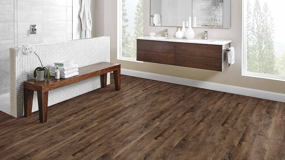 Wood-look luxury vinyl tile in a bathroom
